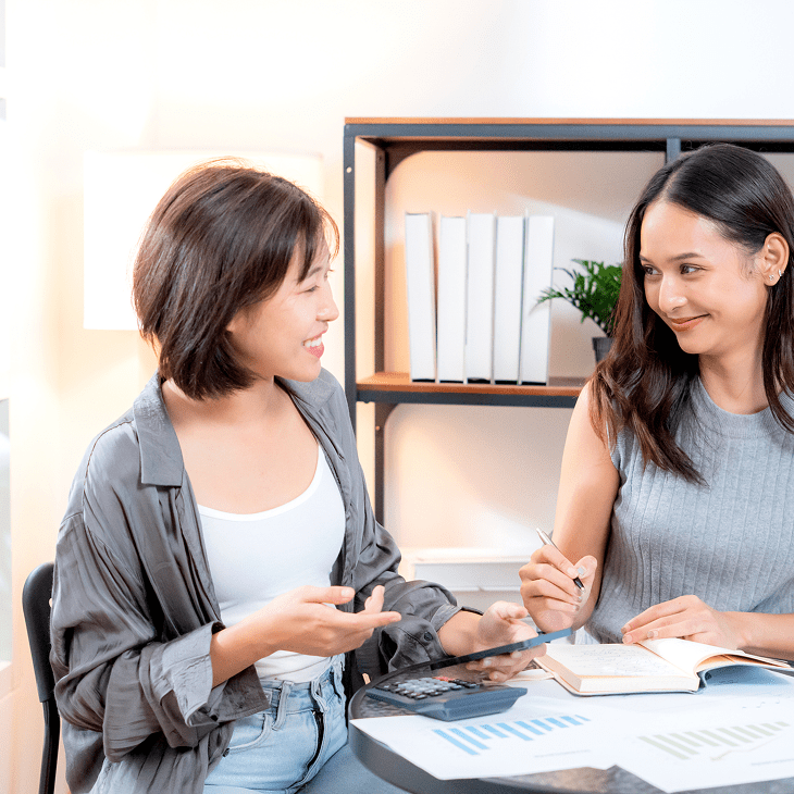 Two women discussing in an office